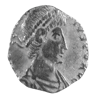 A silver coin with a portrait of a man.