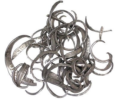 A pile of metal scraps on a white background.