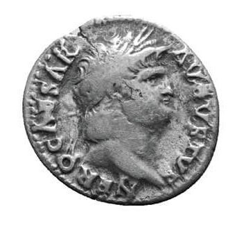 A silver coin minted with the head of a man.