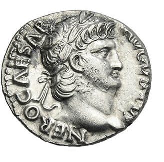 A valuable silver mint coin depicting the profile of a man.