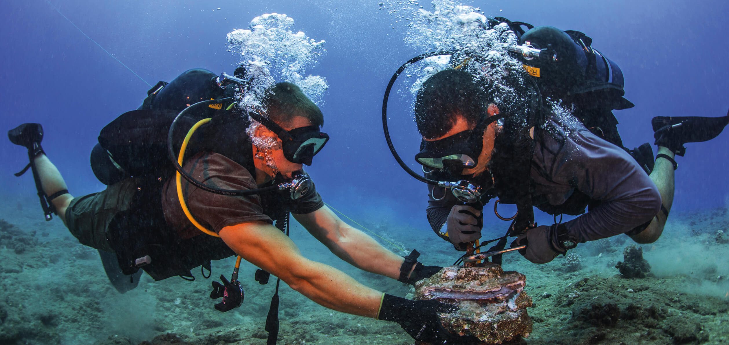US Marines remove corroded zinc anodes from an undersea cable at the Pacific Missile Range Facility in Hawaii, 2016.