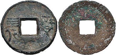 Two historical bronze with a hole in the middle.