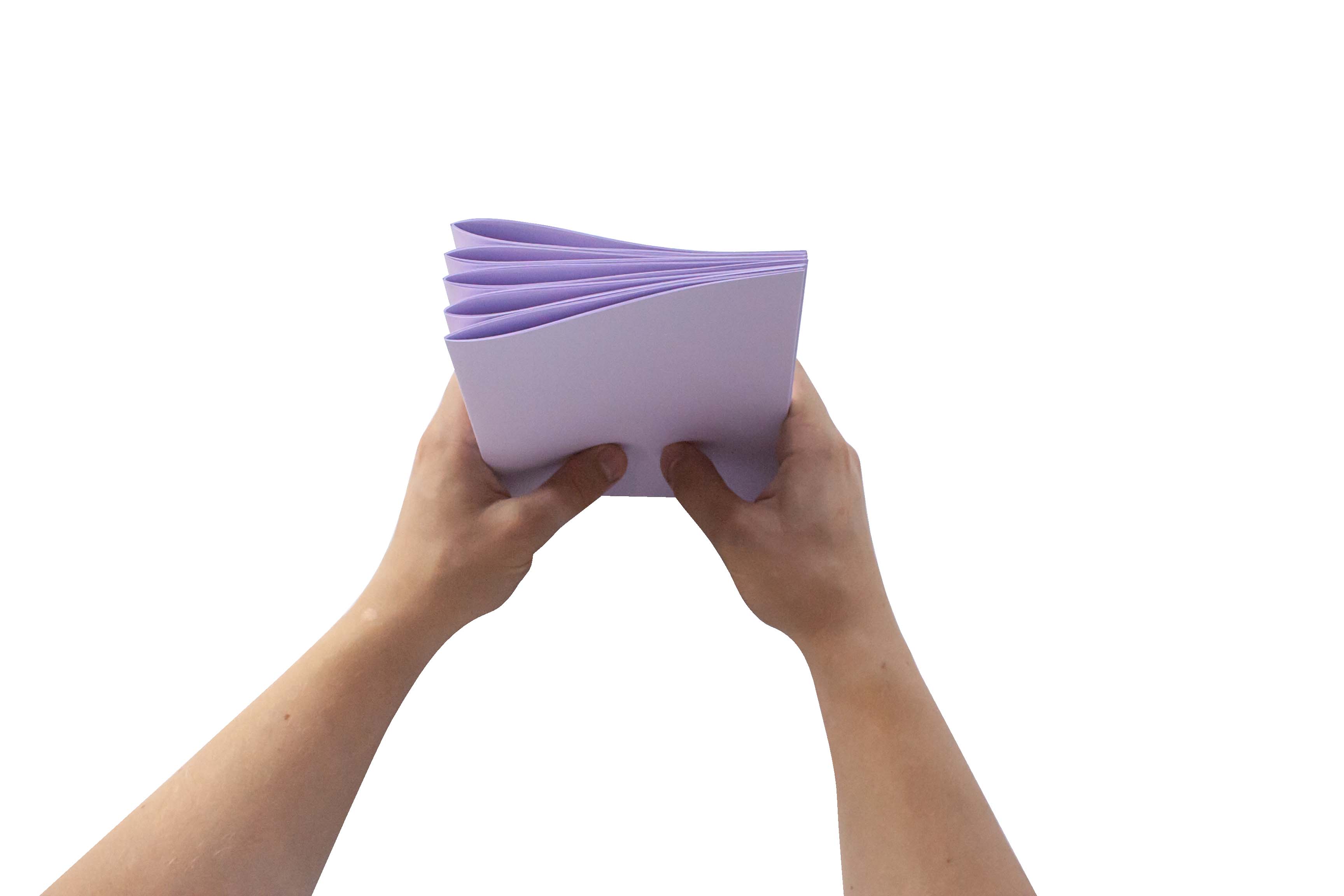 Bookbinding. Hands holding a stack of purple paper fans on a white background.